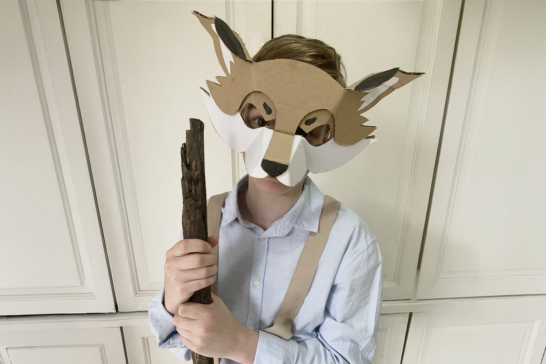 Child dressed up as Fantastic Mr Fox with a cardboard fox mask