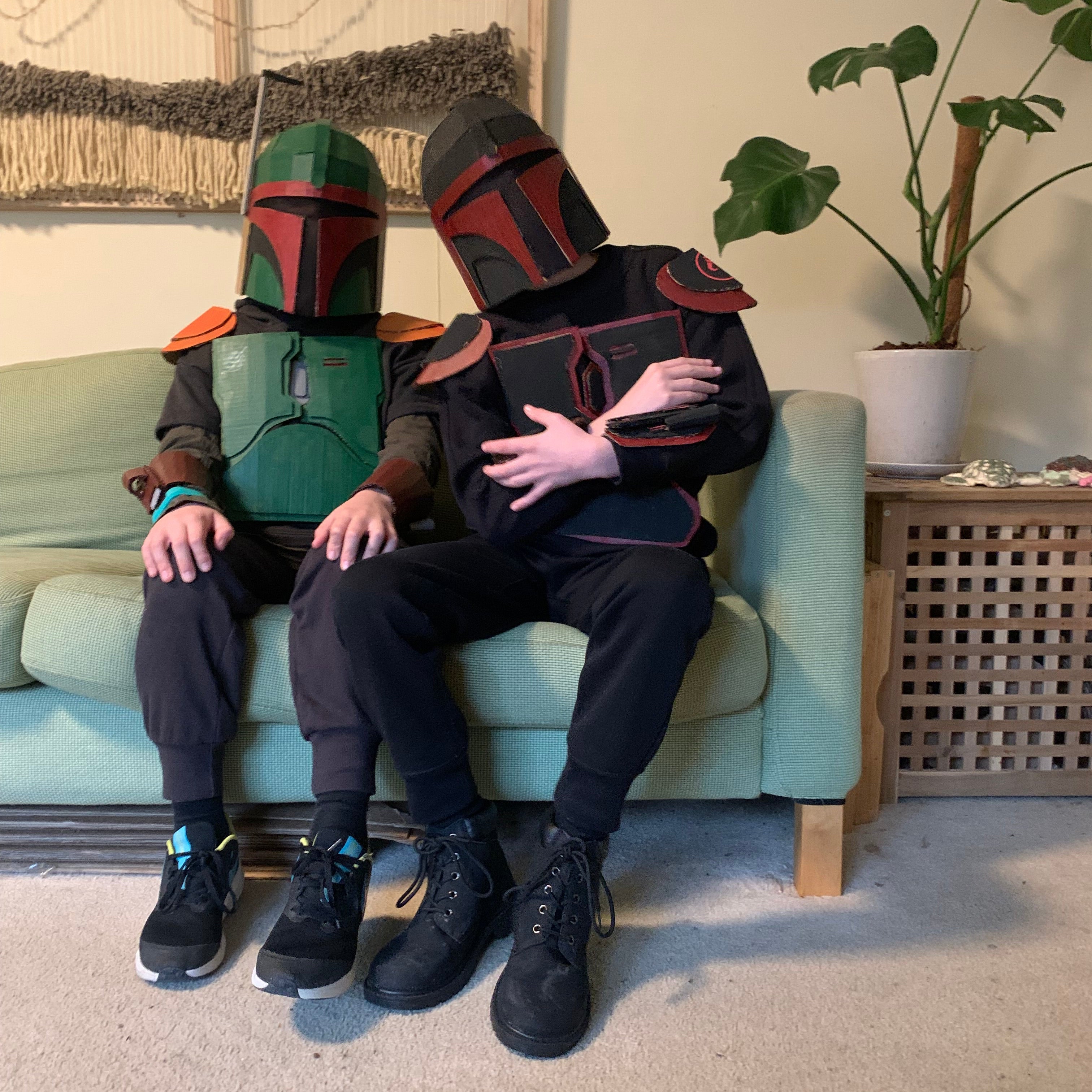 to kids dressed up like Mandalorian Bounty Hunters costumes made of cardboard and painted.