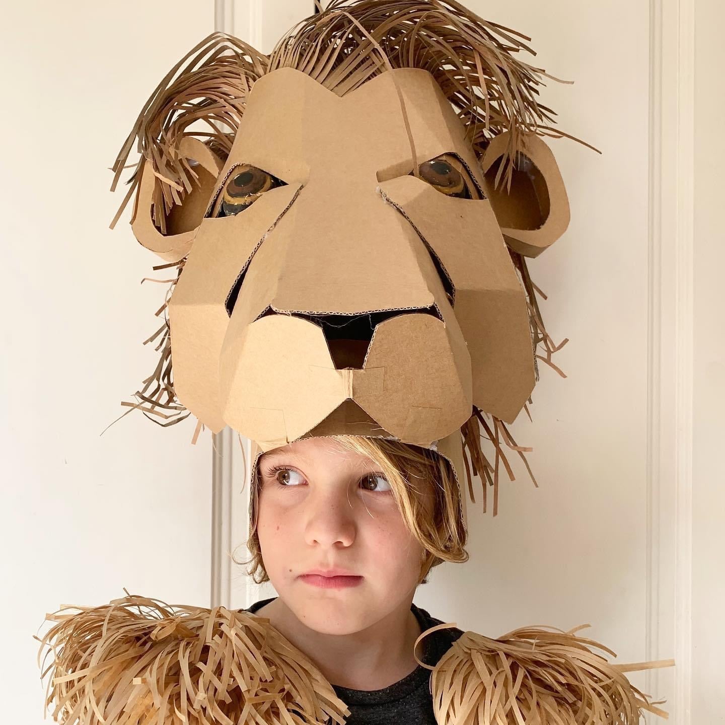 Cardboard and paper lion headdress inspired by Mufasa from the Lion King performance.