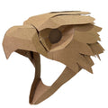 A handmade cardboard eagle , falcon, hawk head mask or costume, crafted from layered corrugated cardboard with a circular cutout for the eye, shown against a plain white background.